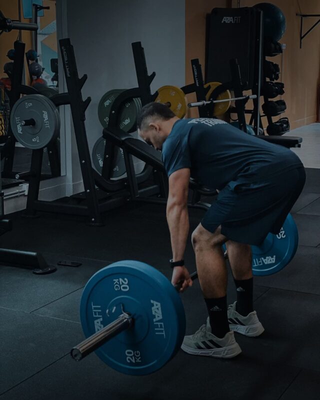 a man lifting weights in a gym